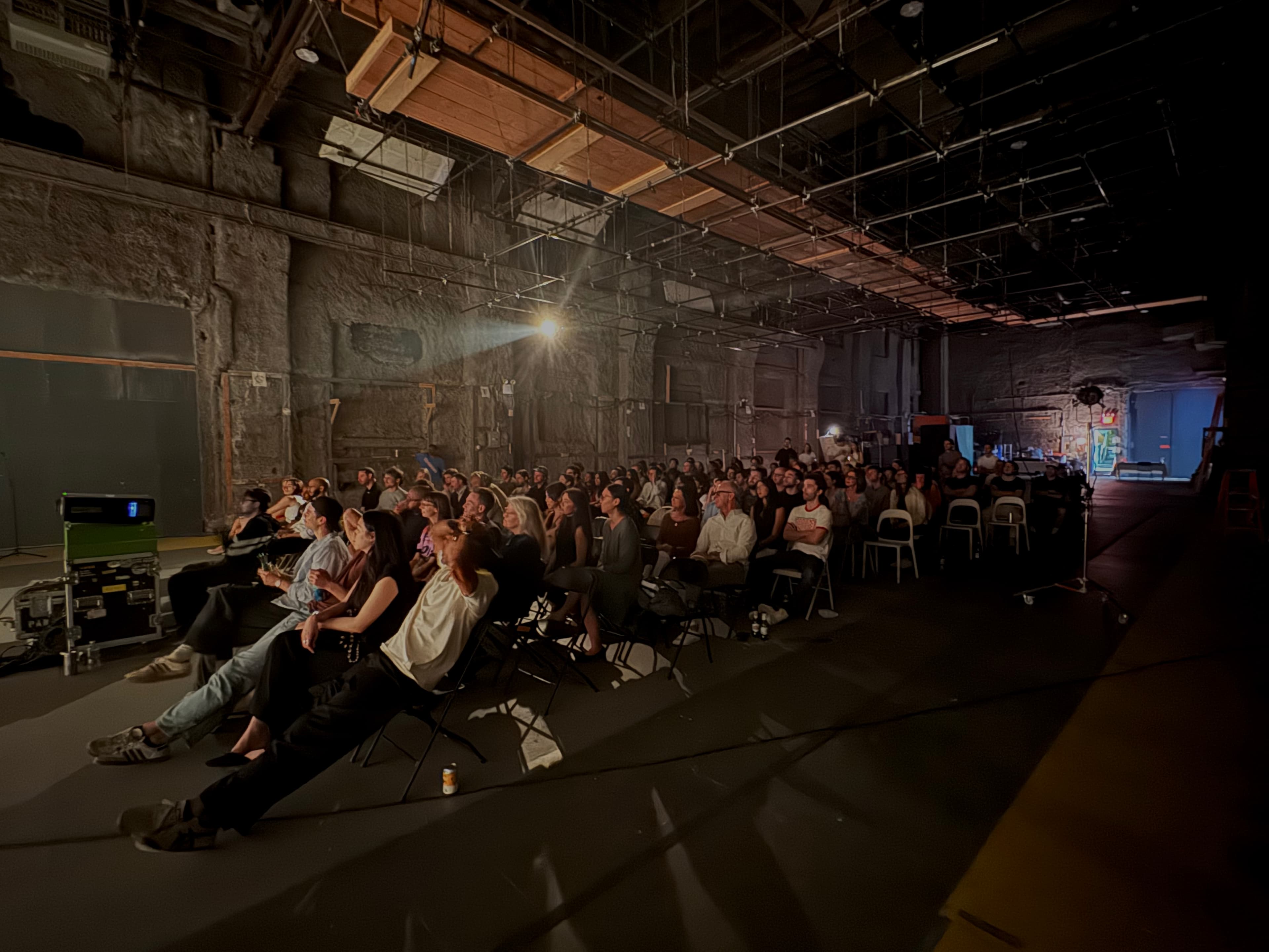 A full Brooklyn audience watching short films at Filmshow